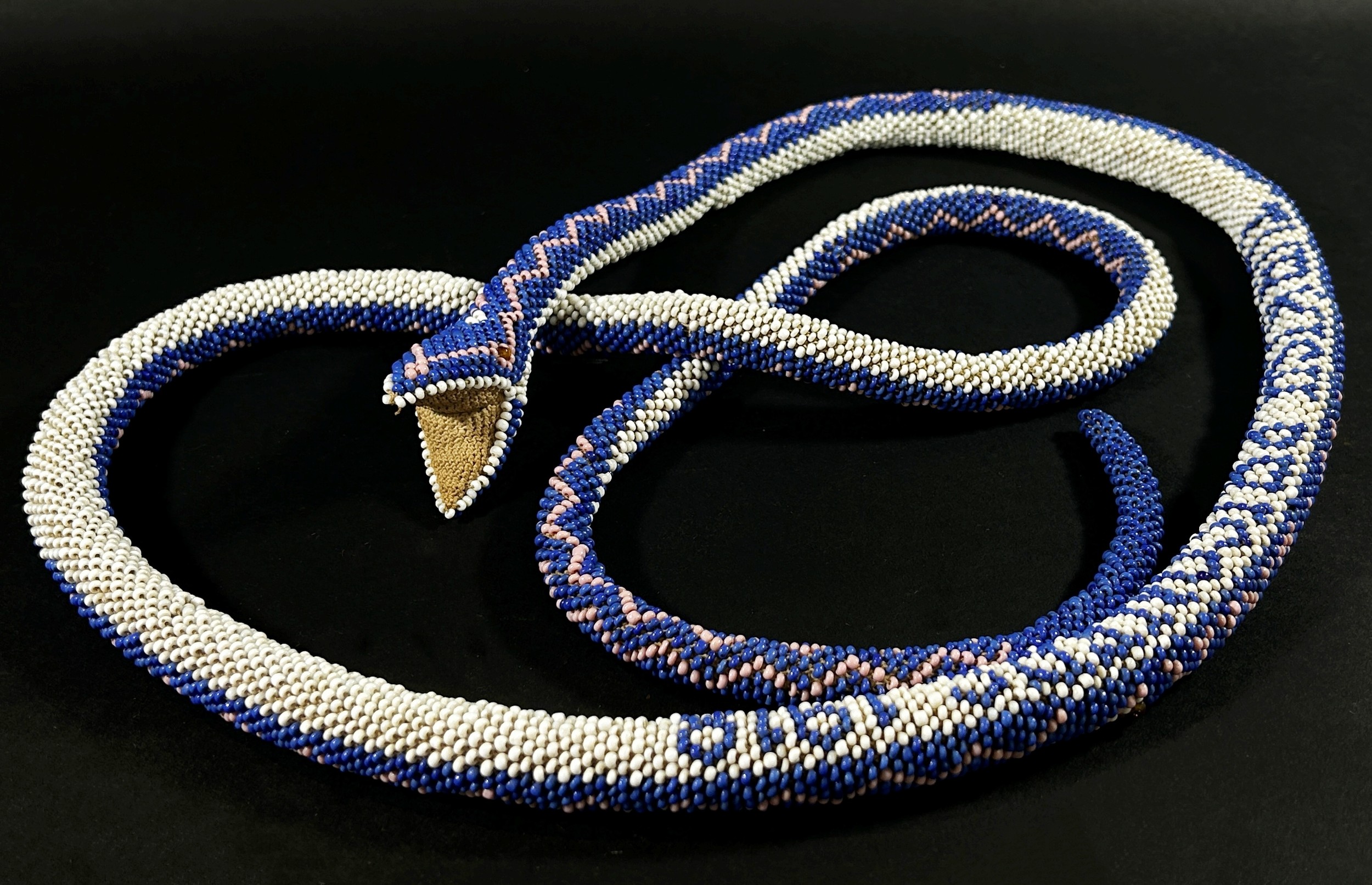 Military interest – A WWI Turkish POW beadwork snake in a white, blue and pink finish, 160cm long