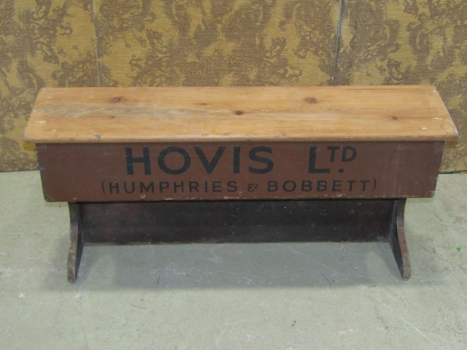 A vintage pine counter top enclosing a drawer with painted script 'Hovis Ltd' (Humphries &