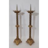 A pair of 19th century continental ecclesiastical gilt brass pricket candlesticks, with flared