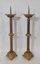 A pair of 19th century continental ecclesiastical gilt brass pricket candlesticks, with flared