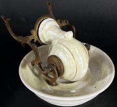 A 19th century Escargot porcelain and brass inkwell and pen stand by J L Basguile of Paris