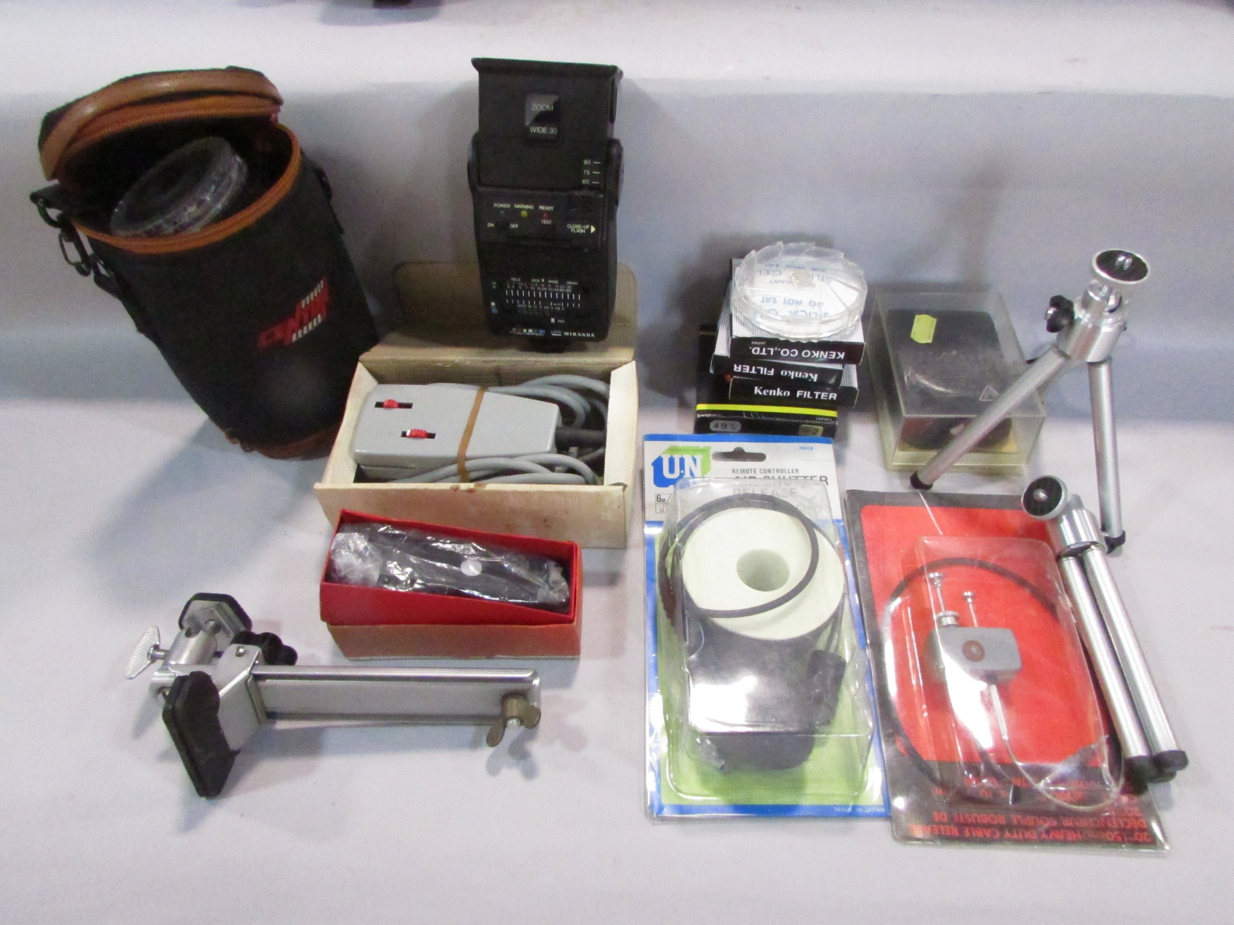 A quantity of photographic equipment including a Minolta 200 MXI camera, a Minolta flash and lens,