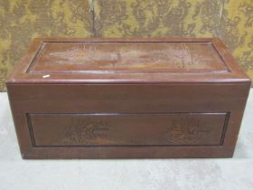 A Chinese style camphor wood coffer with carved ships approaching land, 93cm wide x 46cm deep, x