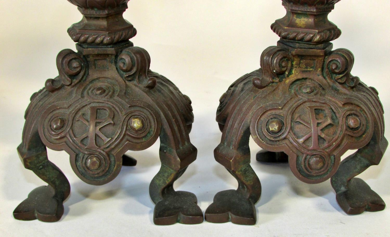 A pair of 19th century continental bronze ecclesiastical candlesticks, with crucifix and other - Image 3 of 5