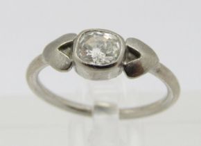 Stylised white metal bezel set diamond solitaire ring, 0.20ct approx, size H/I, 2.3g