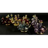 Ten iridescent gilded blown glass swan perfume bottles, together with a pink flamingo perfume
