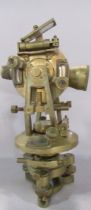 A Stanley of London brass Theodolite with a central compass and a spirit level, 29cm high.