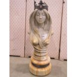 An Art Nouveau style garden or niche figure of a female wearing a cabochon encrusted crown, 75cm