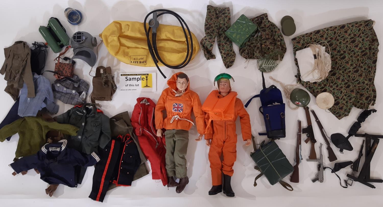 Two GI Joe dolls by Hasbro ©1964 together with a large quantity of unsorted clothing, diving and