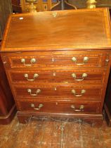 A good quality Edwardian mahogany bureau in the Georgian style, with four tapering frieze drawer,