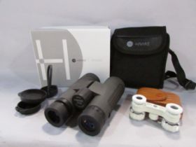 A very good pair of waterproof Hawke Vantage binoculars with shoulder case and strap with its