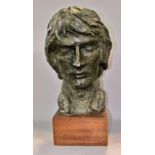 A late 20th century, 1970’s, plaster bust of a bearded man in a bronze patina paint finish, raised