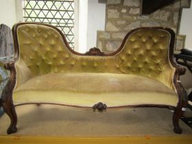 A Victorian mahogany framed parlour room sofa, with shaped outline and upholstered finish,