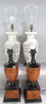 A pair of urn shaped table lamps in a brown mottled marble finish and another pair of white china