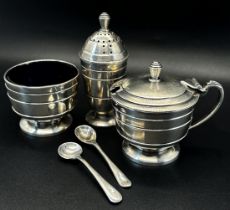 An art deco boxed condiment set, Chester 1927, maker Zachariah Barraclough & Sons with one rogue