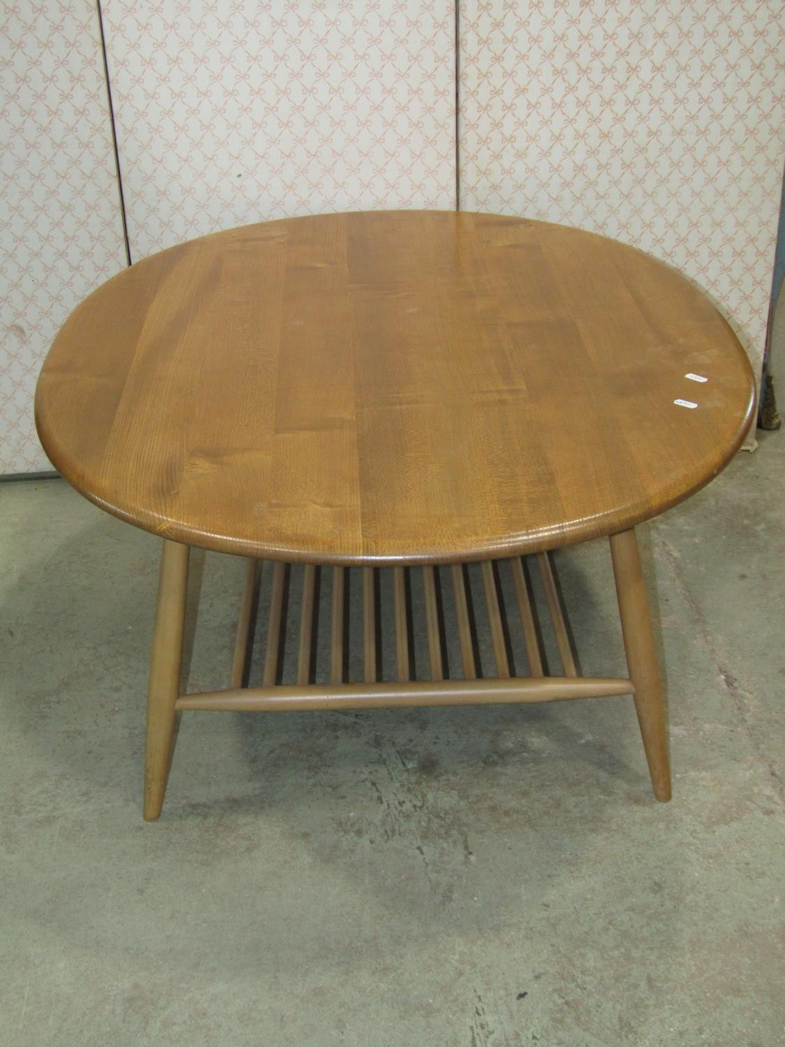 An Ercol occasional table principally in elm, the oval top 100cm max - Image 3 of 3