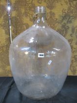 A large clear glass carboy, 92cm high