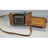A vintage Zeiss Ikon camera, Campur Rapid bellows camera in a leather case