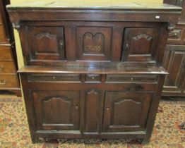 A small 18th century oak Dudarn, the lower section enclosed by two fielded panelled doors and