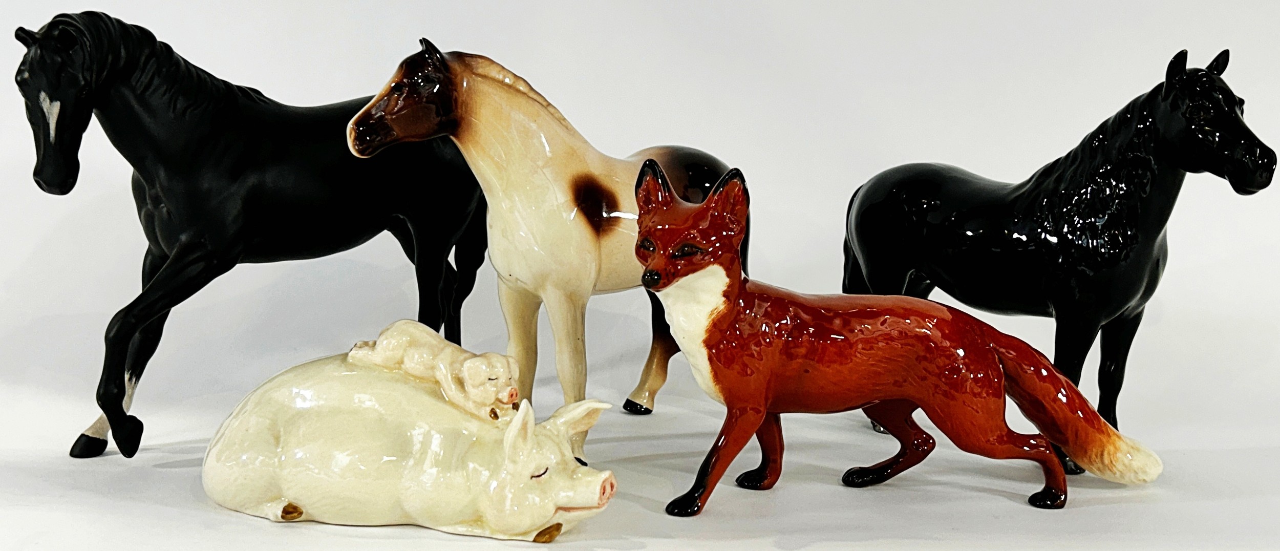 A Beswick black beauty, a fox, a recumbent sow and piglet and two further horses (5) - Image 2 of 3