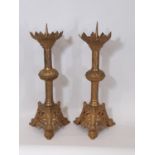 A matched pair of 19th century gilt brass ecclesiastical pricket candle sticks, with open acanthus