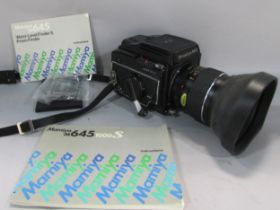 A Mamiya M645 box camera , M645 waist level finder and instruction booklet