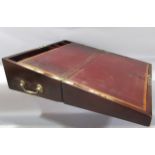 A George III mahogany writing slope, with a red leather lined interior and a secure drawer to the