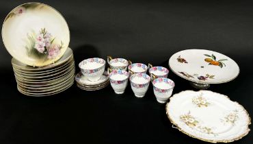 A collection of Royal Rudolstadt porcelain plates with floral detail in pale pastel shades, large