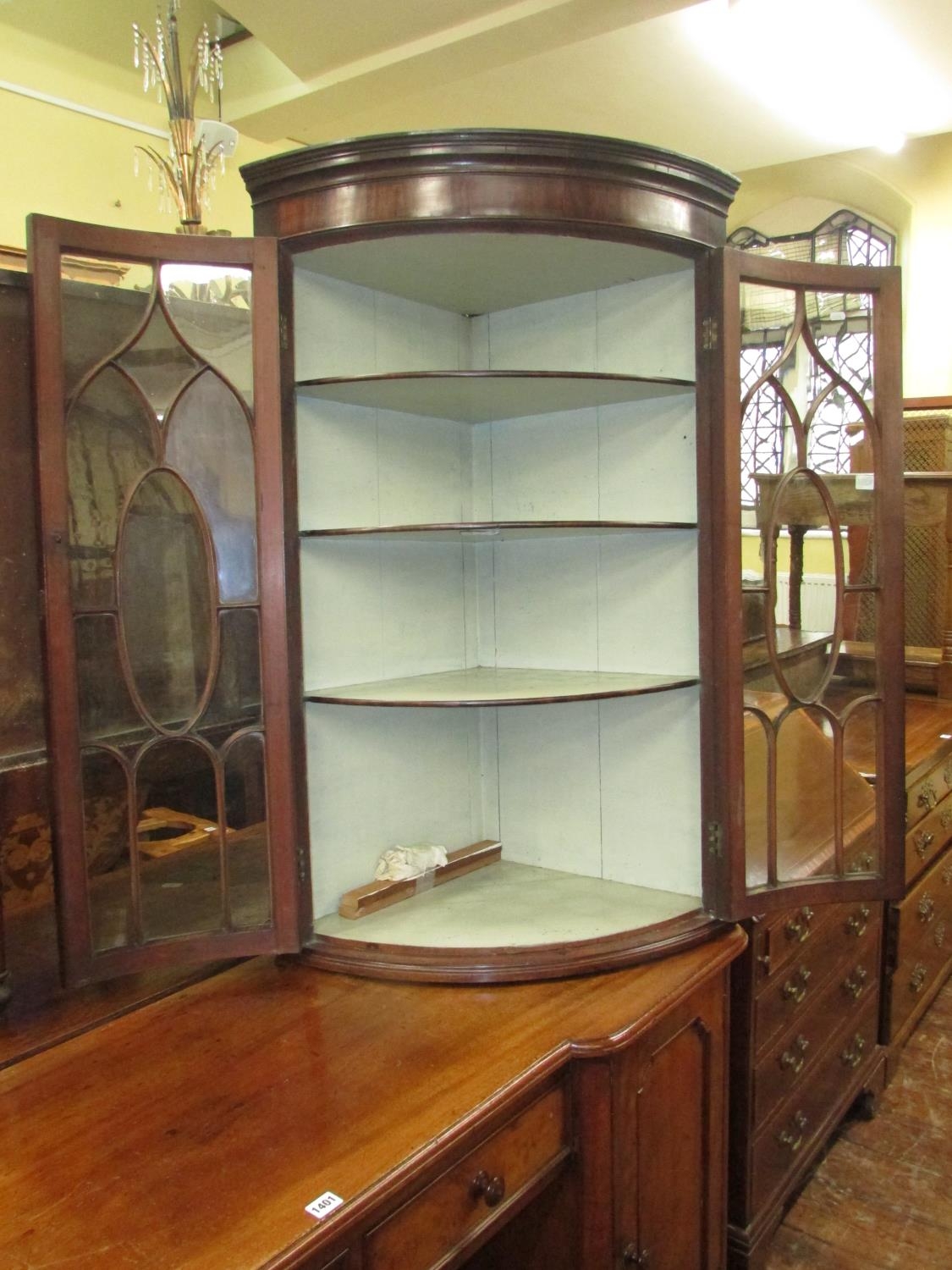 A Regency mahogany bow fronted hanging corner cupboard with astragal glazed panelled doors, original - Image 2 of 3