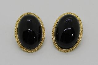 Pair of 14k oval onyx clip earrings, 3.9g