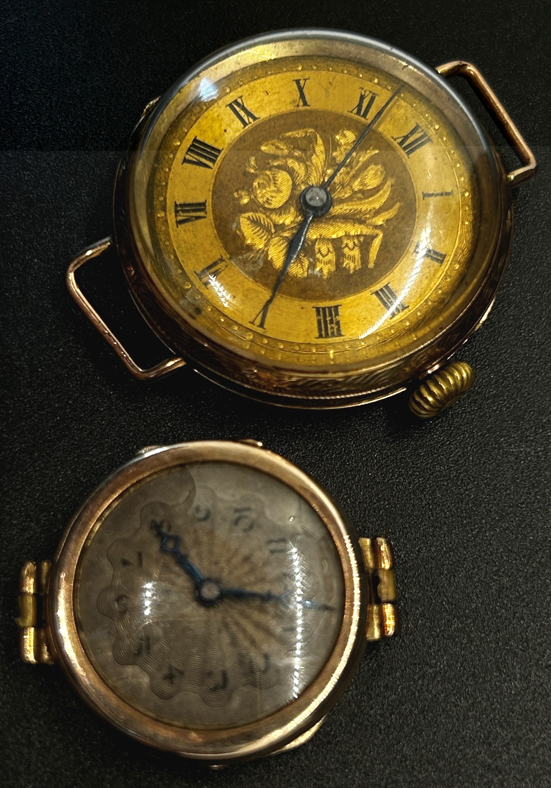 A 9ct yellow gold cased fob watch, with engraved dial populated with black Roman numerals,