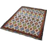 A Chobi kilim with an all over multicoloured hooked diamond pattern 195 x 155 approximately