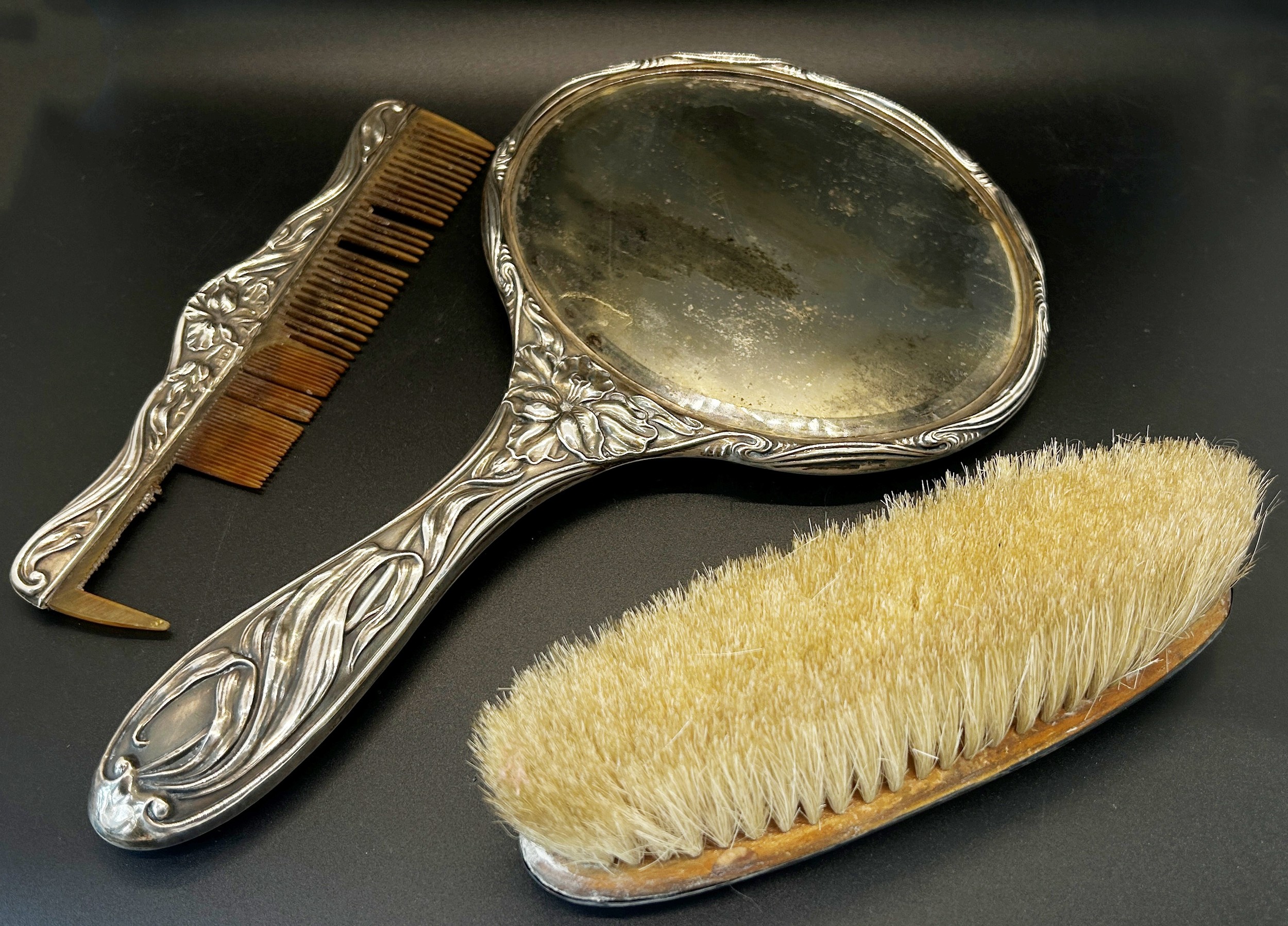 A silver Art Nouveau hand mirror with all over floral pattern, Chester 1909, maker J & R Griffin, - Image 2 of 2