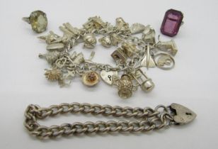 Good silver charm bracelet with novelty charms including an easel blackboard and a corkscrew, a