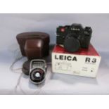 A Leica R3 electronic camera in its original box and leather case, together with a Sangamo Weston