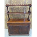 A Victorian mahogany buffet, the lower section enclosed by a pair of panelled doors and a frieze