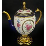 A porcelain coffee pot - the Faberge egg imperial teapot, the ivory coloured body within a blue