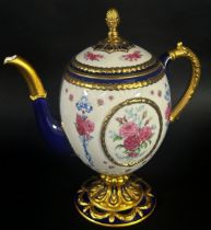 A porcelain coffee pot - the Faberge egg imperial teapot, the ivory coloured body within a blue