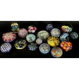 A collection of 19, 20th century, glass paperweights in varying designs Millefiori, flowers, bubbles