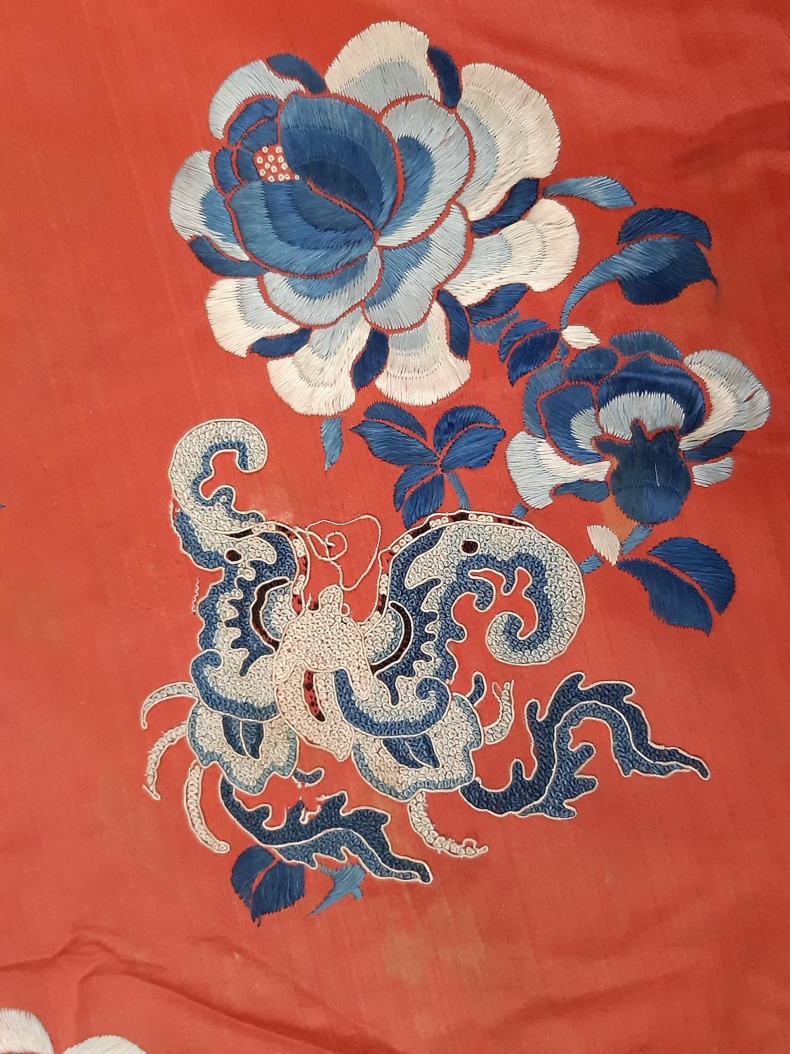 A late 19th/ early 20th century Chinese robe of red silk embroidered with flowers, moths and other - Image 5 of 8