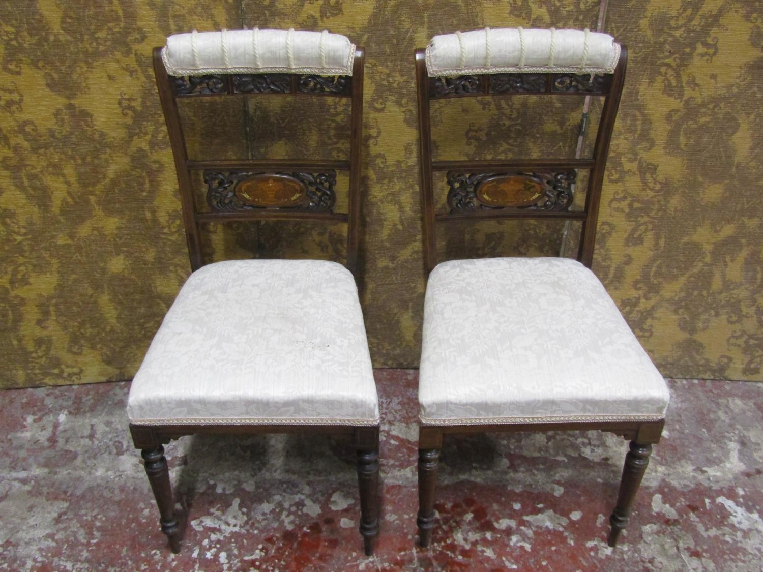 A pair of Edwardian rosewood occasional chairs, with inlaid detail, pierced and carved splats,