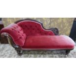 A Victorian chaise with carved mahogany frame