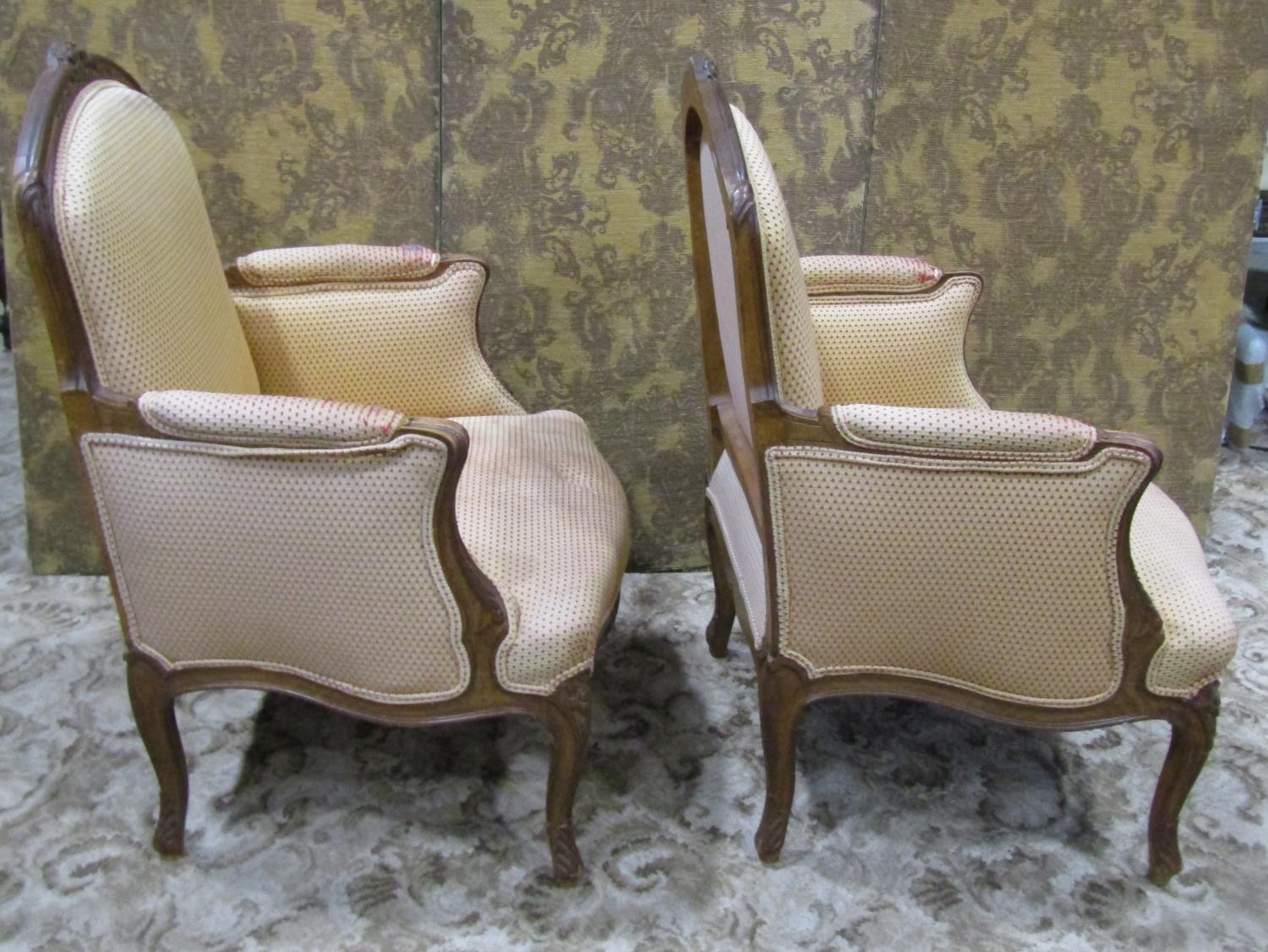 A pair of upholstered armchairs with carved show wood frames on cabriole supports - Image 4 of 9