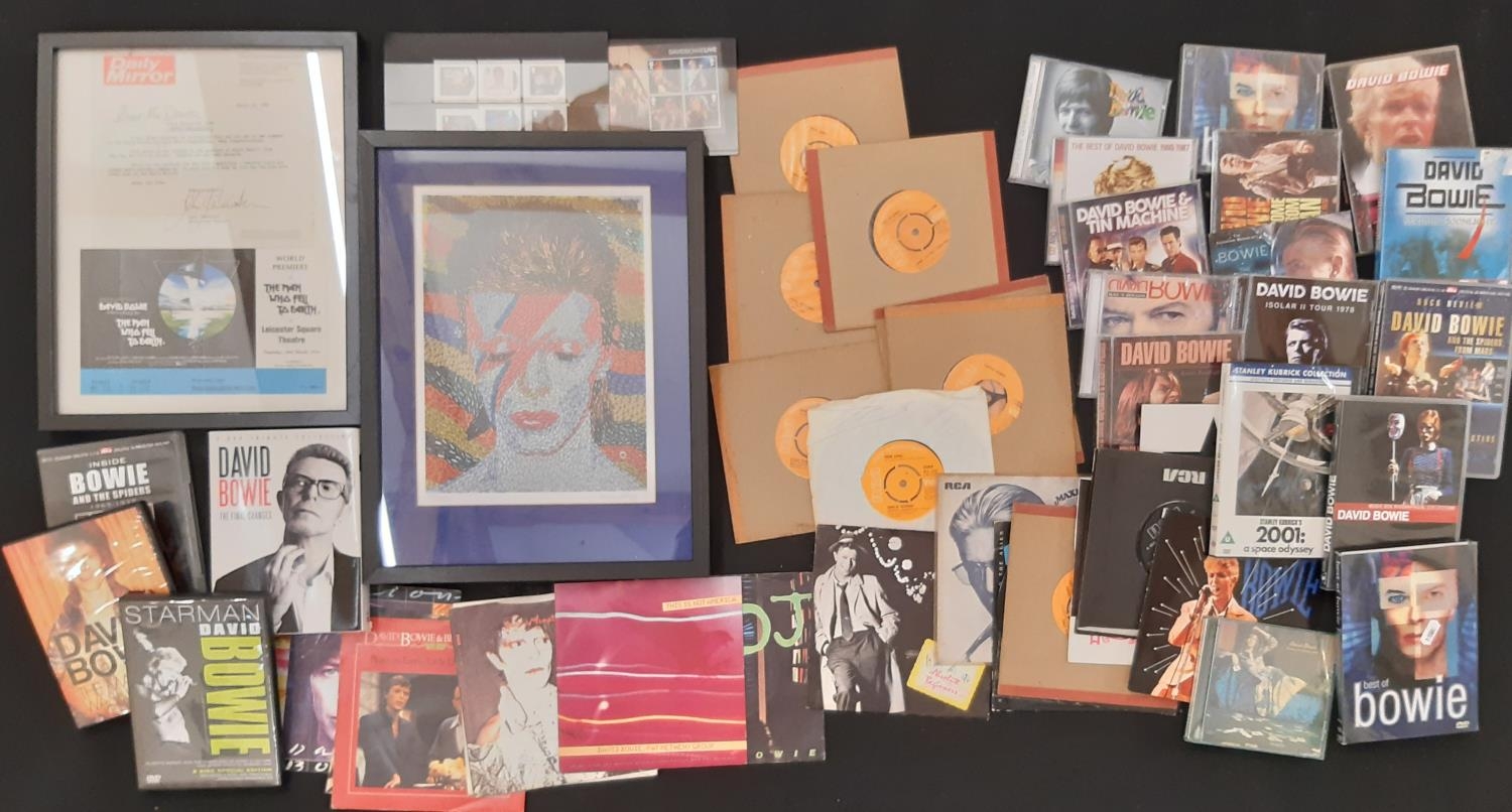 A collection of David Bowie related music and ephemera, to include: CDs, DVDs and Singles vinyl