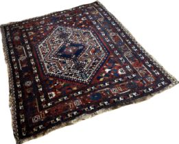 An old tribal Qashgai Persian rug with a central medallion with stylised flowers , 190 x 156cm
