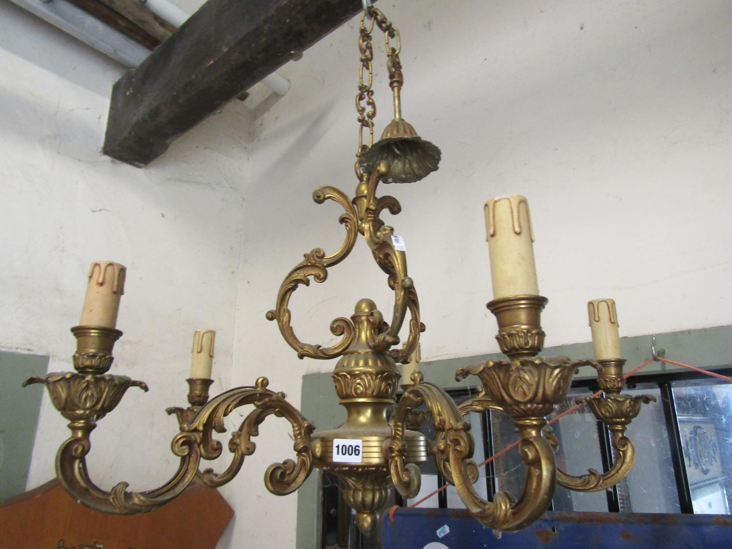 A good quality cast brass five branch candelabra with scrolling detail, 68cm diameter approx, 50cm