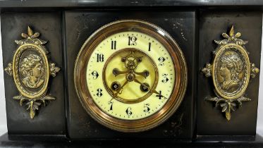 A Victorian black slate cased mantle clock