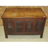 A small old English style oak coffer with carved and panelled framework, 88cm wide