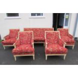 A French drawing room suite comprising a three seat sofa and four matching tub chairs, the frames