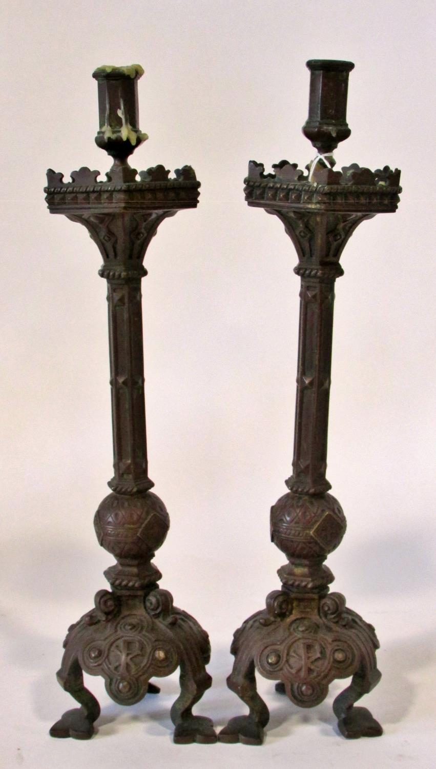 A pair of 19th century continental bronze ecclesiastical candlesticks, with crucifix and other - Image 2 of 5